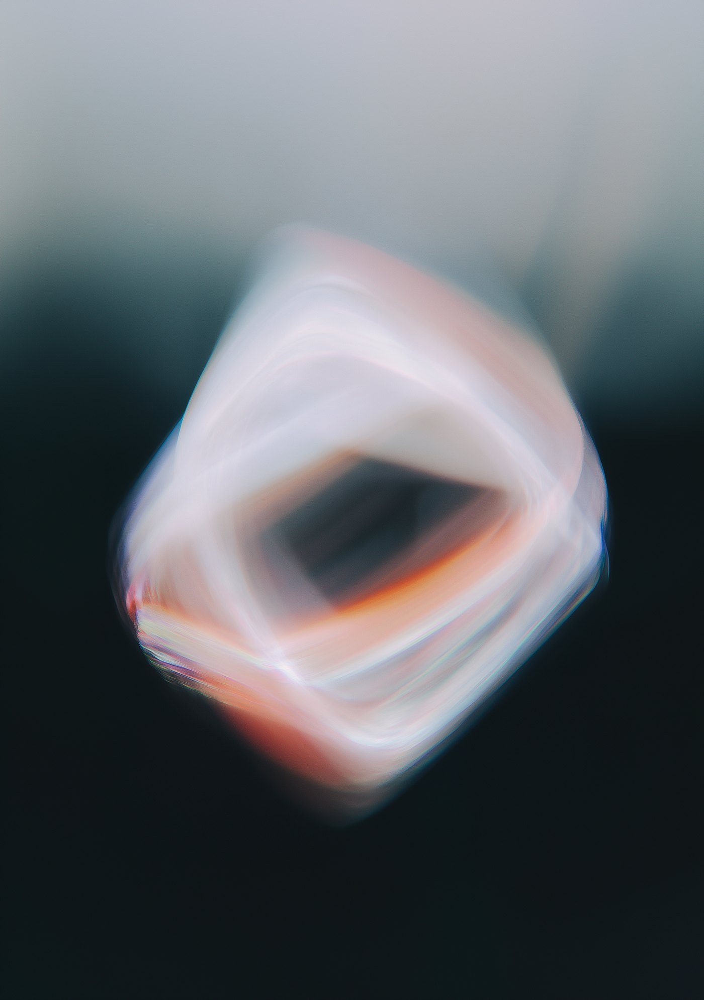 Abstract soft light form in pale pink and coral against deep teal and black