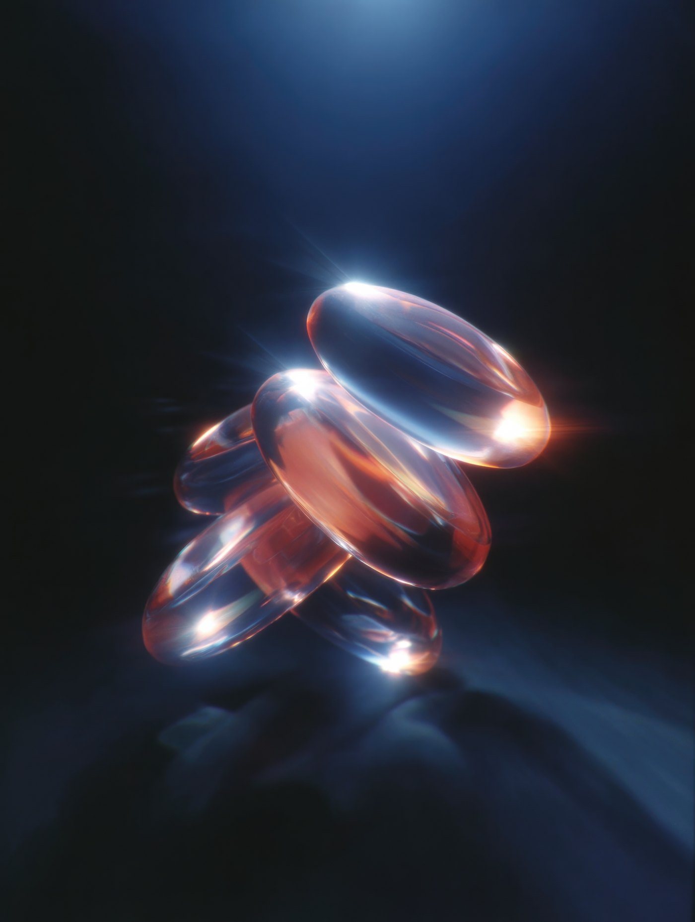 Translucent glowing capsules stacked in blue light